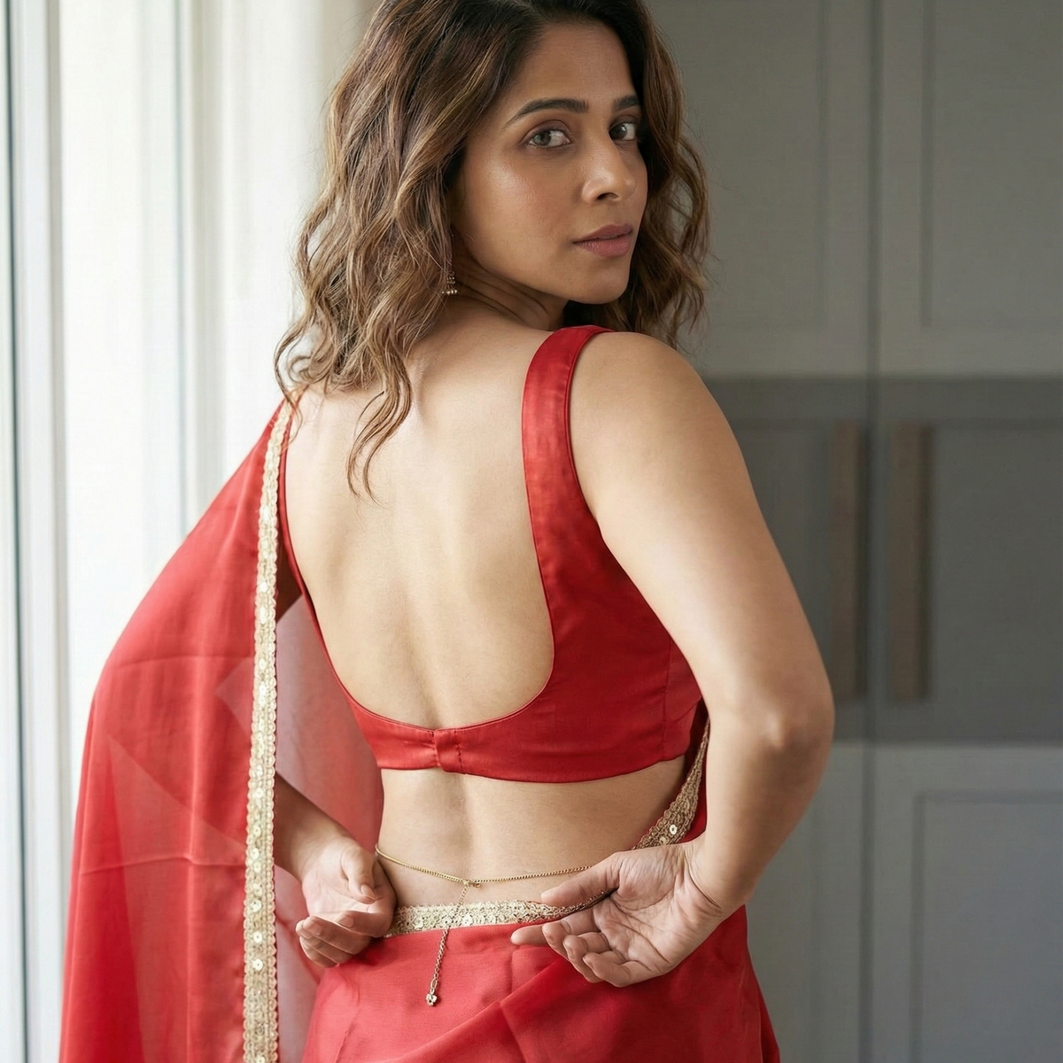 Regal Ember After Dark Saree close-up – rich red royal crepe with gleaming border, earns attention